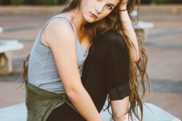 woman sitting on picnic table