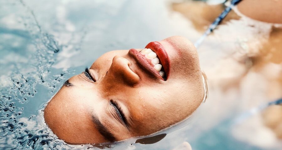 floating woman on body of water